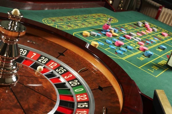Live roulette table displayed on mobile phone with betting options